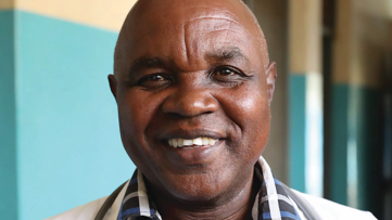 A man smiling in front of the camera