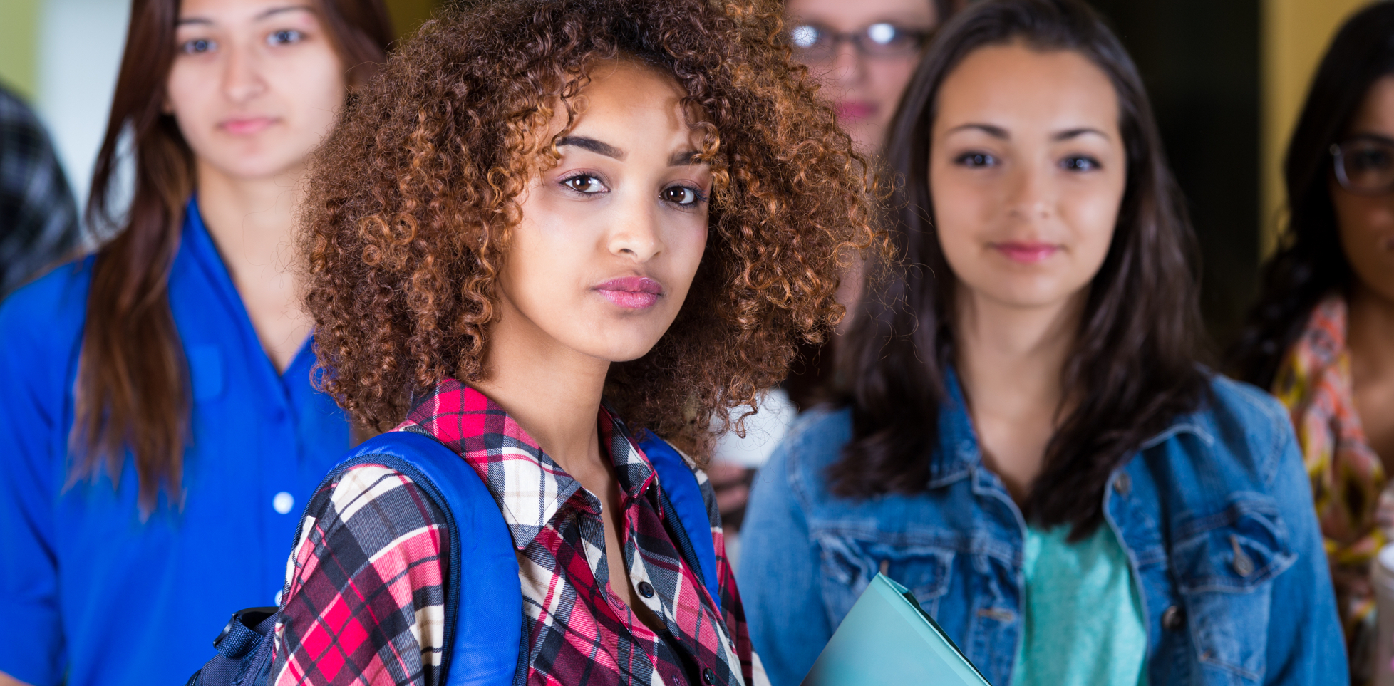 A group of young students together at school